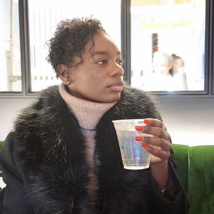 Wellness Woman holding cup of water